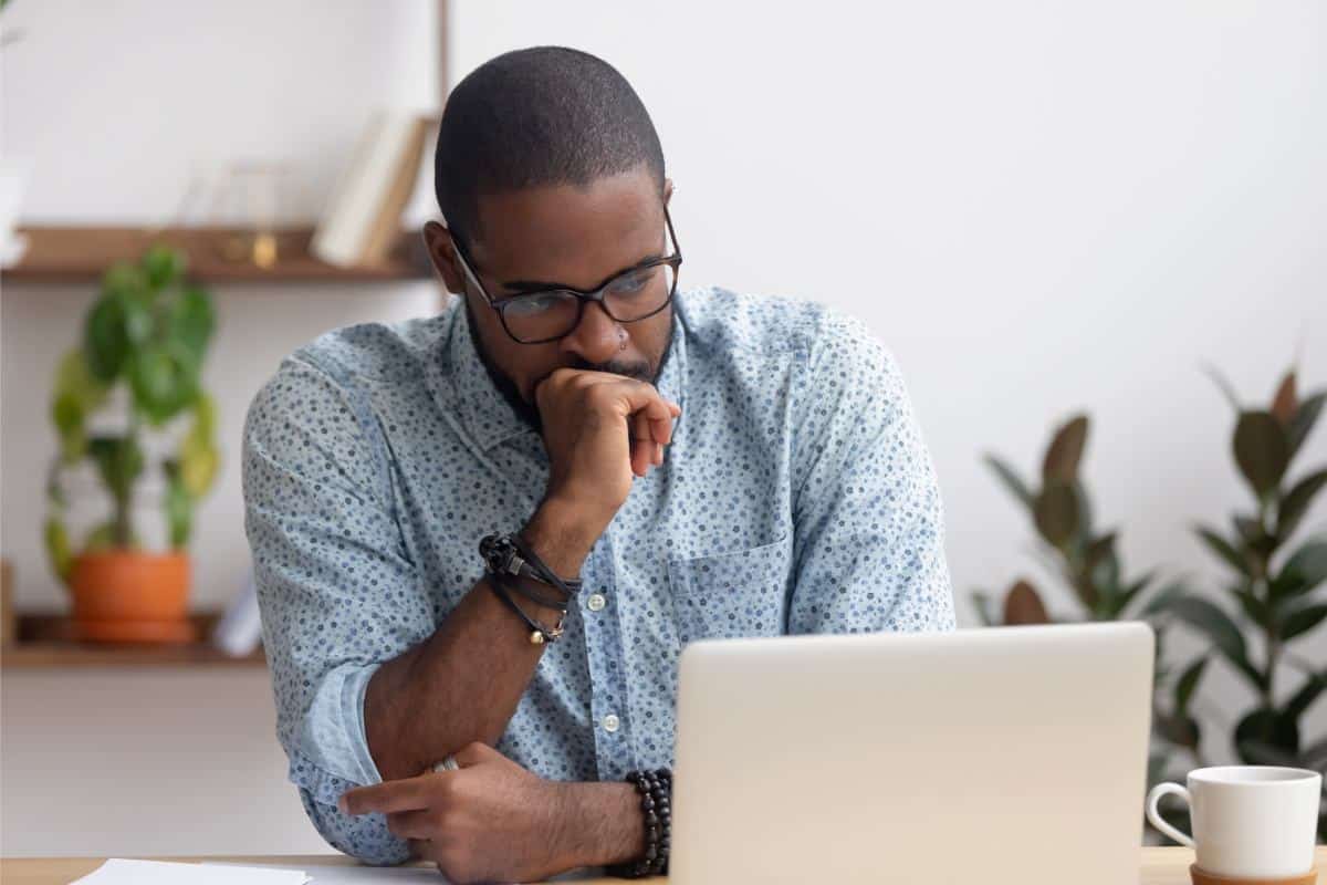 A person looking on laptop